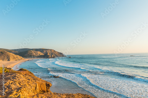 Portugal cliffs on the Atlantic ocean on a summer day. Sunset time and big copy spae photo