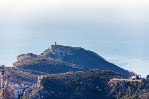 Panoramic view of Cap d'Or Tower in Moraira, Spain. View from Cumbre del Sol Mountain, also known as "Puig Llorenca"