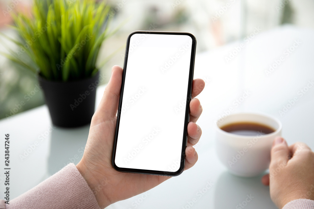 female hands holding phone with isolated screen in summer cafe female hands holding phone with isolated screen in summer cafe
