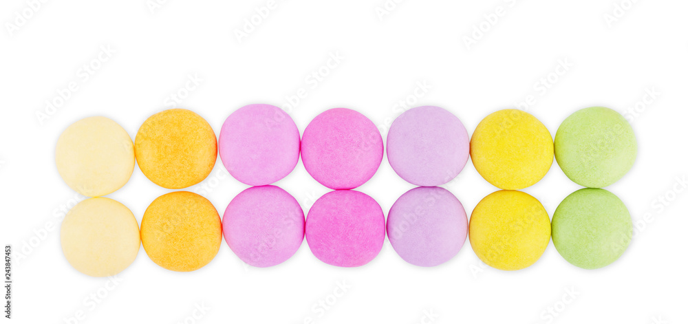 Multicolored round candies on a white background Multicolored round candies on a white background