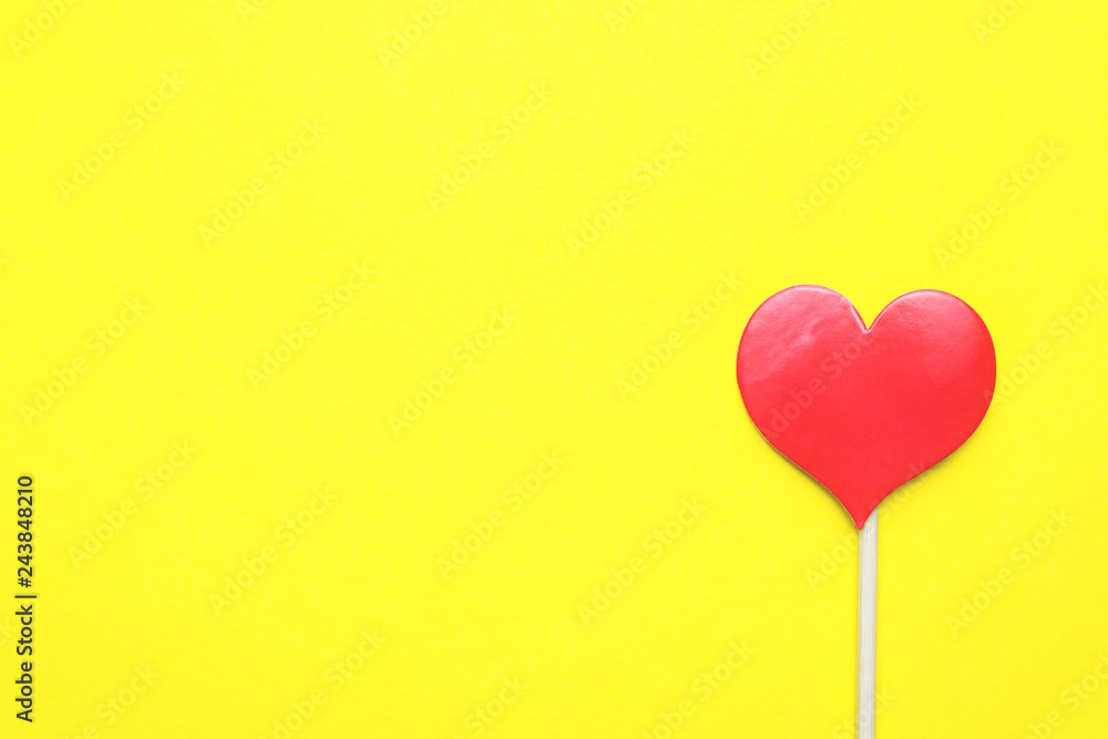 Valentines day concept. Red hearts on yellow background. Copy space.