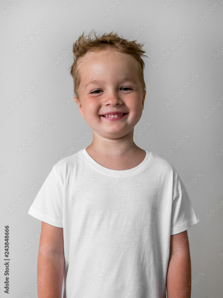 little smiling boy in white shirt isolated on white background little smiling boy in white shirt isolated on white background