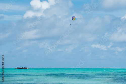 Parasailing on tropical beach in Indian Ocean