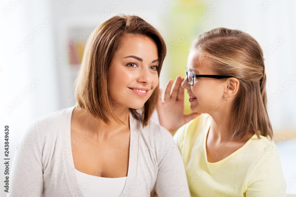trust, gossiping and family concept - happy daughter whispering secret to her mother trust, gossiping and family concept - happy daughter whispering secret to her mother