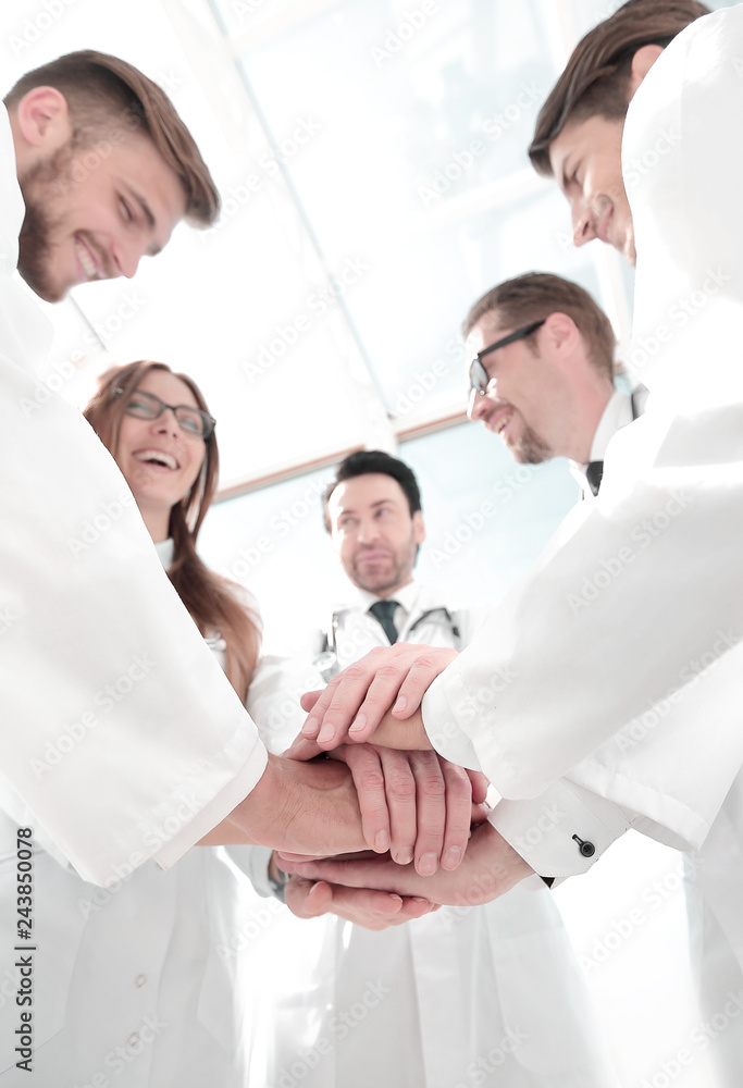 bottom view. close up of a doctors folded their hands together bottom view. close up of a doctors folded their hands together