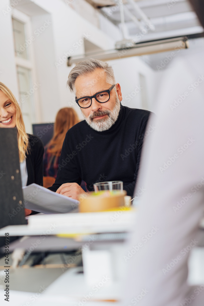 Thoughtful bearded businessman in a meeting Thoughtful bearded businessman in a meeting