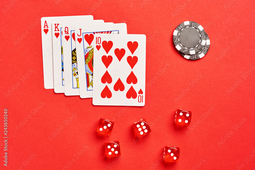 Flat lay concept. Casino abstract photo. Poker game with flash royal chips  and dices on red background. Theme of gambling. Stock Photo | Adobe Stock