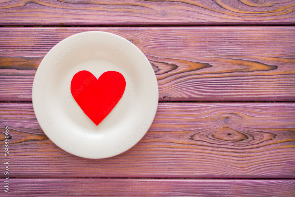 Love heart on a plate. The concept of nutrition love, heartwarming, losing weight because of love. Love heart on a plate. The concept of nutrition love, heartwarming, losing weight because of love.