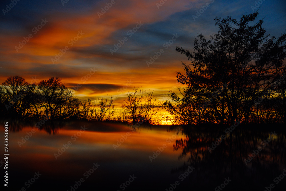 Mirrored stunning sunset with wonderful colors in Germany