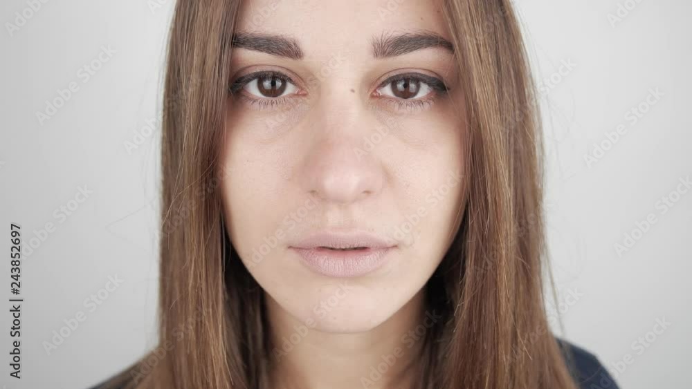 Close up portrait. Young girl straightens hair.Real emotions Close up portrait. Young girl straightens hair.Real emotions