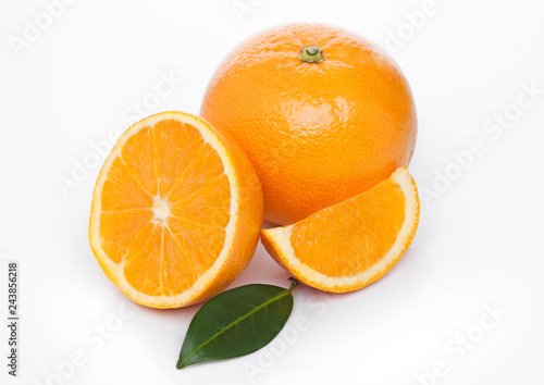 Fresh organic raw oranges with peeled halves
