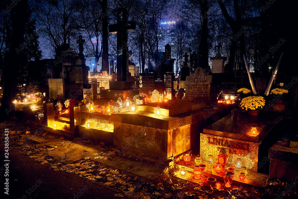 Memento mori - lights and graves on All Saints' Day in the Powazki Cemetery (Polish: Cmentarz Powazkowski) - is a historic cemetery located in the Wola district, western part of Warsaw, Poland.