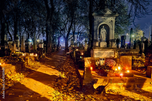 Memento mori - lights and graves on All Saints' Day in the Powazki Cemetery (Polish: Cmentarz Powazkowski) - is a historic cemetery located in the Wola district, western part of Warsaw, Poland.