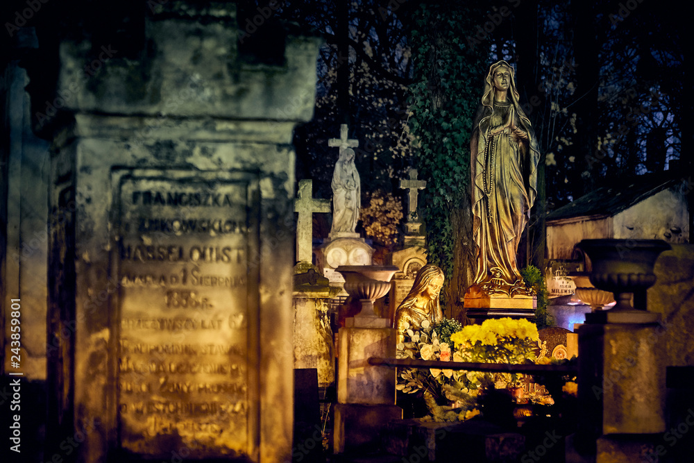 Memento mori - lights and graves on All Saints' Day in the Powazki Cemetery (Polish: Cmentarz Powazkowski) - is a historic cemetery located in the Wola district, western part of Warsaw, Poland.