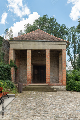 Old door on the façade of stone building