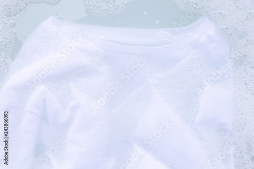 Soak cloth before washing, white t-shirt