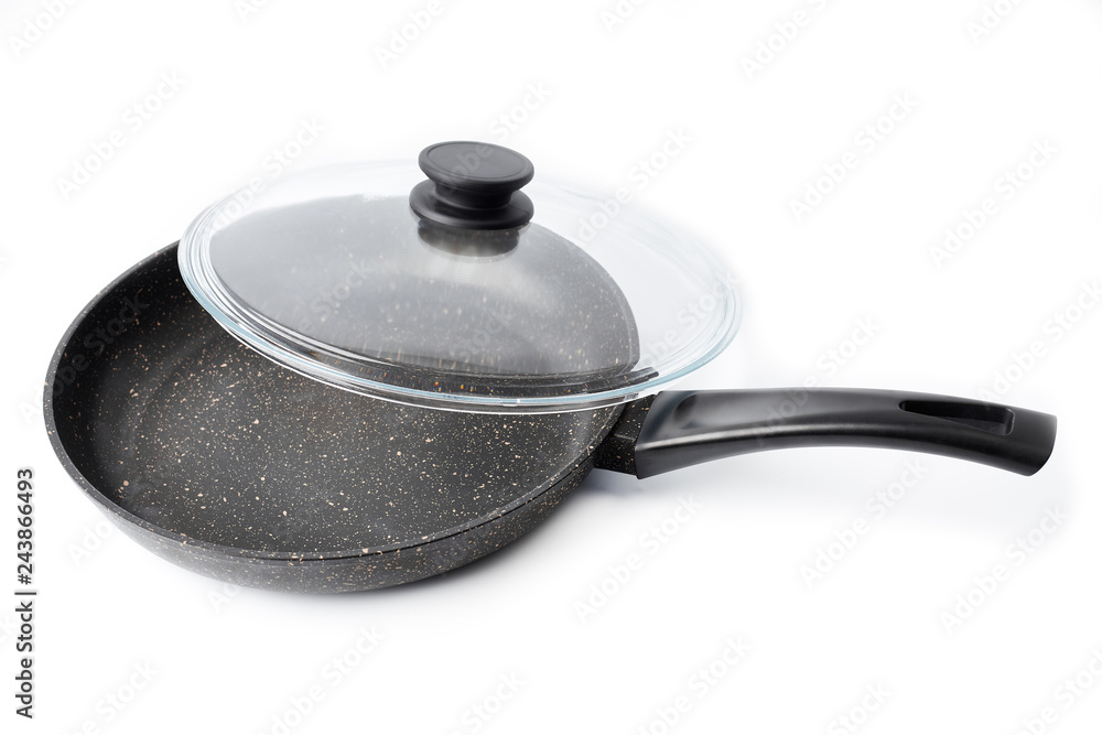 New black pan on a white background. Dishes. New black pan on a white background. Dishes.