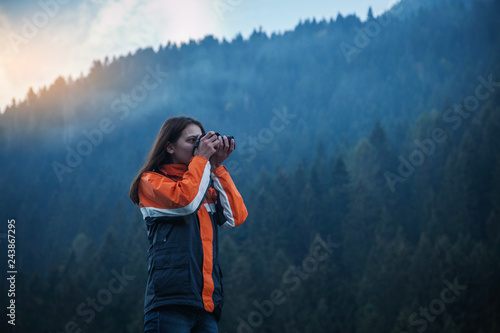 Girl Photographer in Pine Forest © andrii_popovych