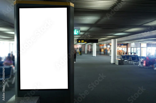 mock up of vertical blank advertising billboard or light box showcase with people waiting at airport, copy space for your text message or media content, advertisement, commercial and marketing concept