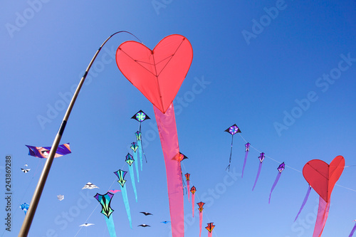 Red Heart Kite in a Blue Sky in fght photo