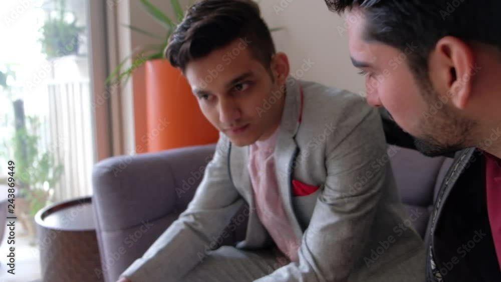 Indian male friend is consoled and supported by his guy mate as they discuss the stress and frustration and distress and pain reason on gimbal Indian male friend is consoled and supported by his guy mate as they discuss the stress and frustration and distress and pain reason on gimbal