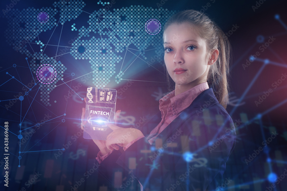 The concept of business, technology, the Internet and the network. A young entrepreneur working on a virtual screen of the future and sees the inscription: Fintech The concept of business, technology, the Internet and the network. A young entrepreneur working on a virtual screen of the future and sees the inscription: Fintech