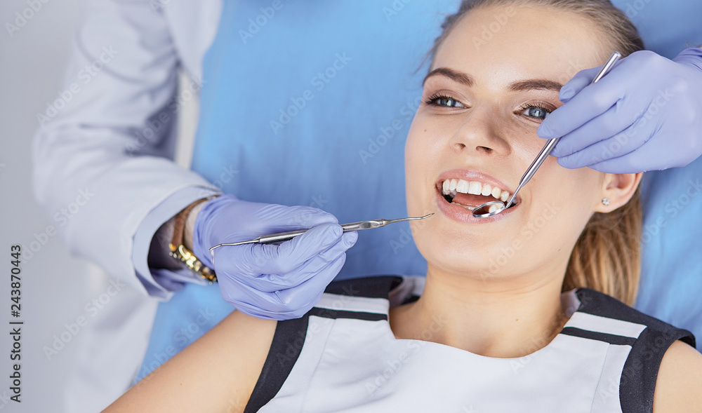 beautiful girl in the dental chair on the examination at the de beautiful girl in the dental chair on the examination at the de