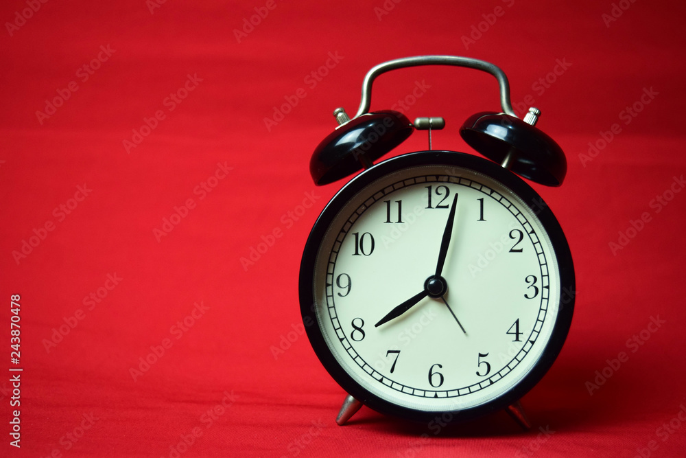 Clock ticking to 8 o'clock on the red background Clock ticking to 8 o'clock on the red background