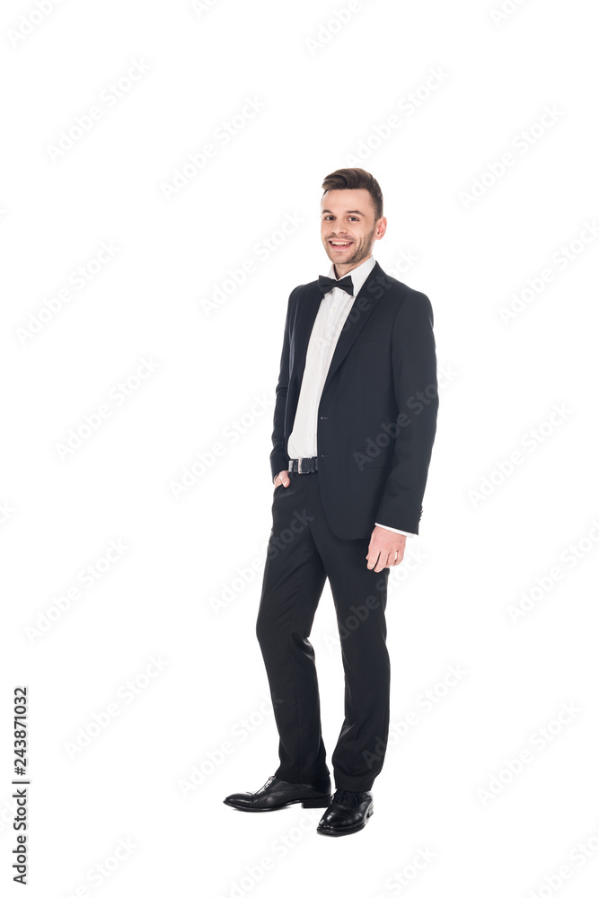handsome smiling man posing in black tuxedo and tie bow isolated on white handsome smiling man posing in black tuxedo and tie bow isolated on white