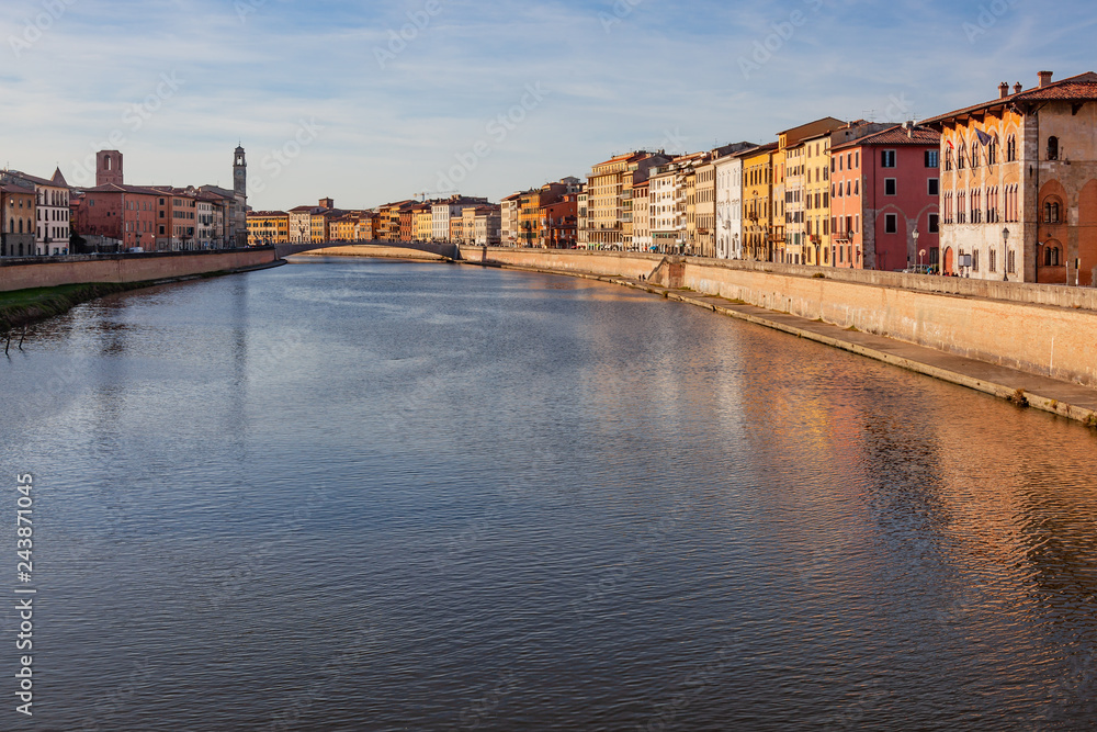 View along the embankment of Arno river in historic part of Pisa, Italy