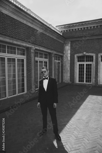 handsome man in a suit outside the building. black and white photo © Make_story Studio