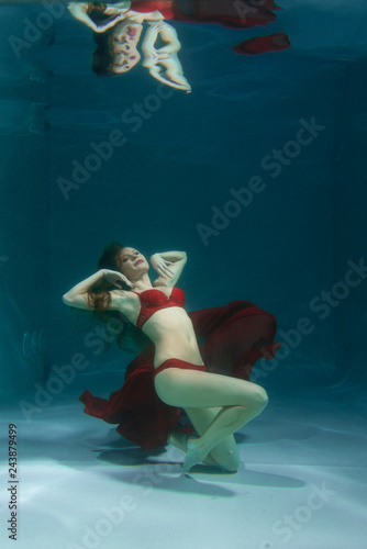 pretty underwater fashion girl swimming on holidays