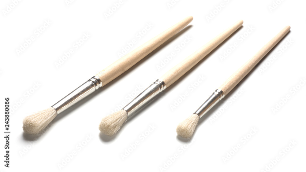 Drawing tools, set of three paint brushes on a white background Drawing tools, set of three paint brushes on a white background