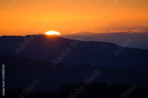 silhouette sunset mountain fog valley