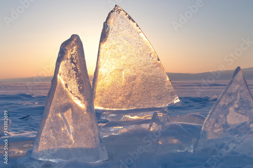 Colorful sunset over the crystal ice of Baikal lake photo