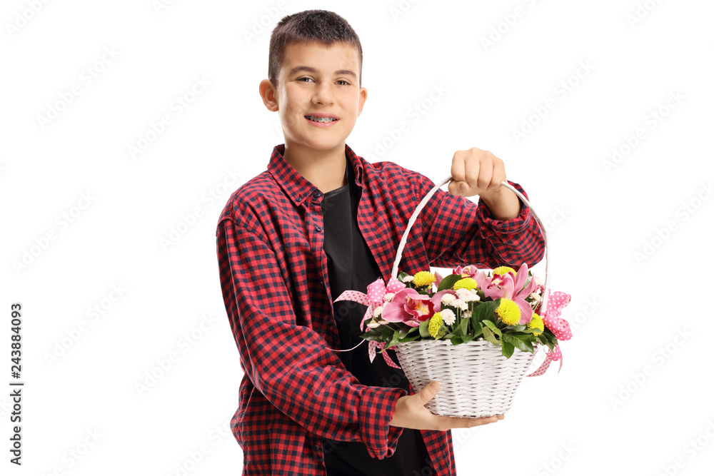Young boy holding a white basket with orchids and other flowers Young boy holding a white basket with orchids and other flowers
