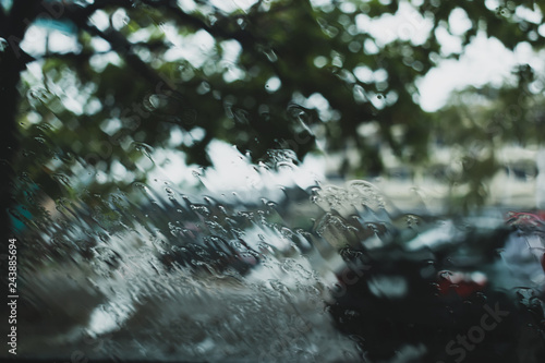 water rain drop on windshield of car driving on road