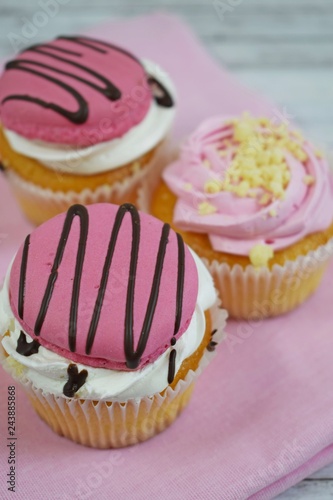 Delicious cakes on wooden background.Sweet dessert for coffee. photo