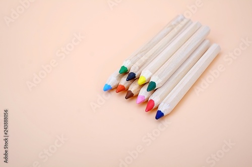 Colour pencils isolated on plain pink background