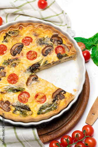 Baked homemade quiche pie in ceramic baking form