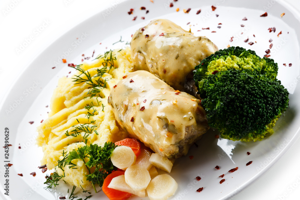 Roast meatballs with mashed potatoes and broccoli on white background Roast meatballs with mashed potatoes and broccoli on white background