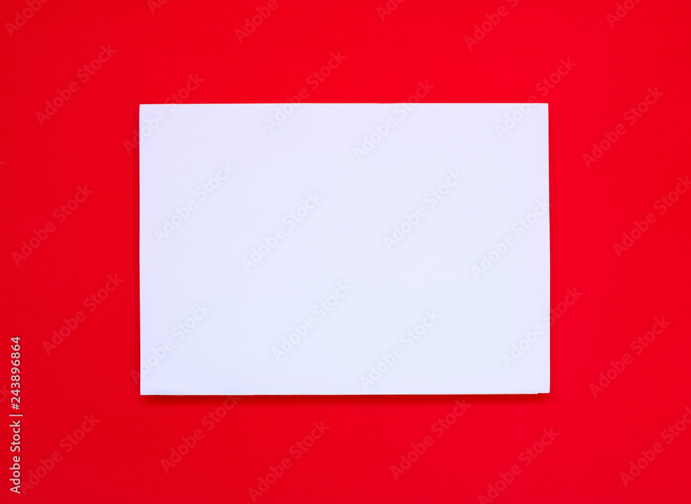 Fototapeta premium Blank white paper on red art paper.