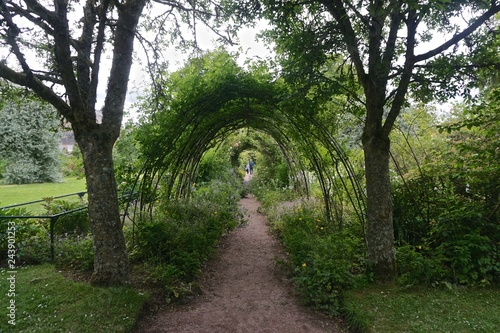 An arbor in the garden at Cawdor Castle in the Highlands of Scotland. The castle is built around a 15th-century tower house. photo