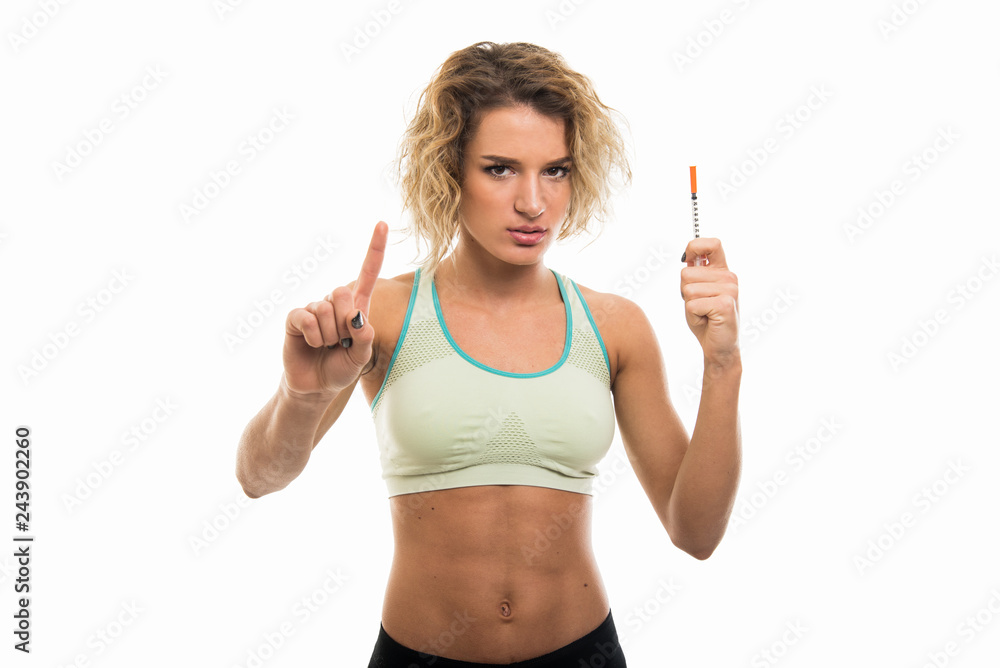 Portrait of beautiful young fit girl showing diabetes shot Portrait of beautiful young fit girl showing diabetes shot