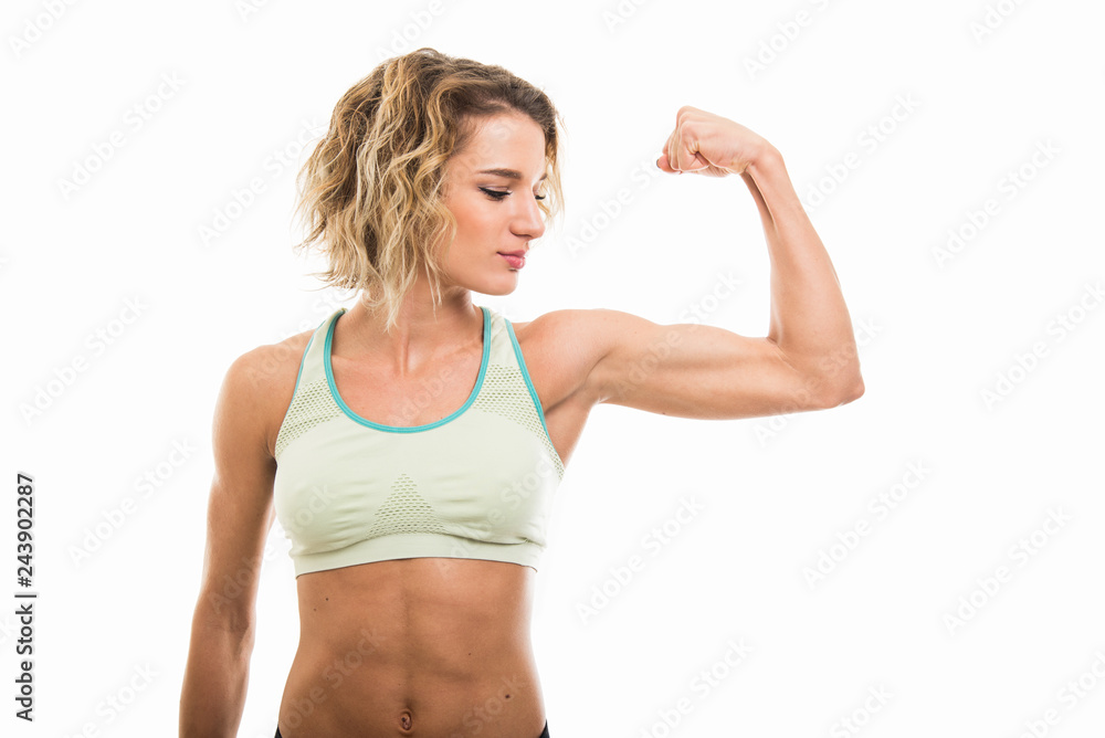 Portrait of fit girl showing her biceps Stock Photo