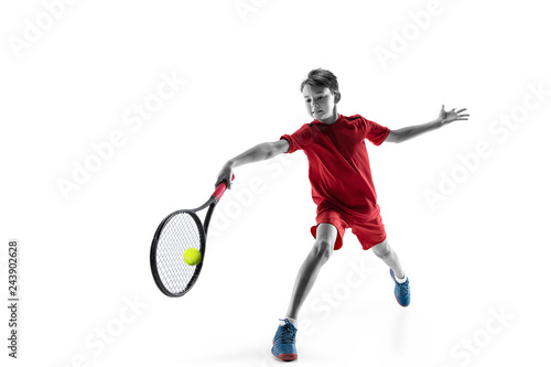 Young teen boy tennis player in motion or movement isolated on white studio background. The sport, exercise, training concept © master1305