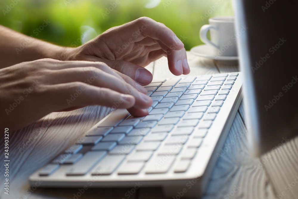 Close-up picture of male hands typing on desktop computer keyboard Close-up picture of male hands typing on desktop computer keyboard