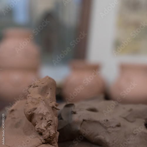 close-up of pottery clay on blurred background of pots. children's crafts