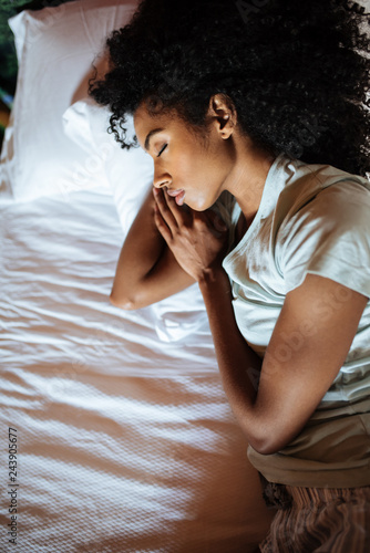 Obraz na płótnie Beautiful black woman sleeping in bed