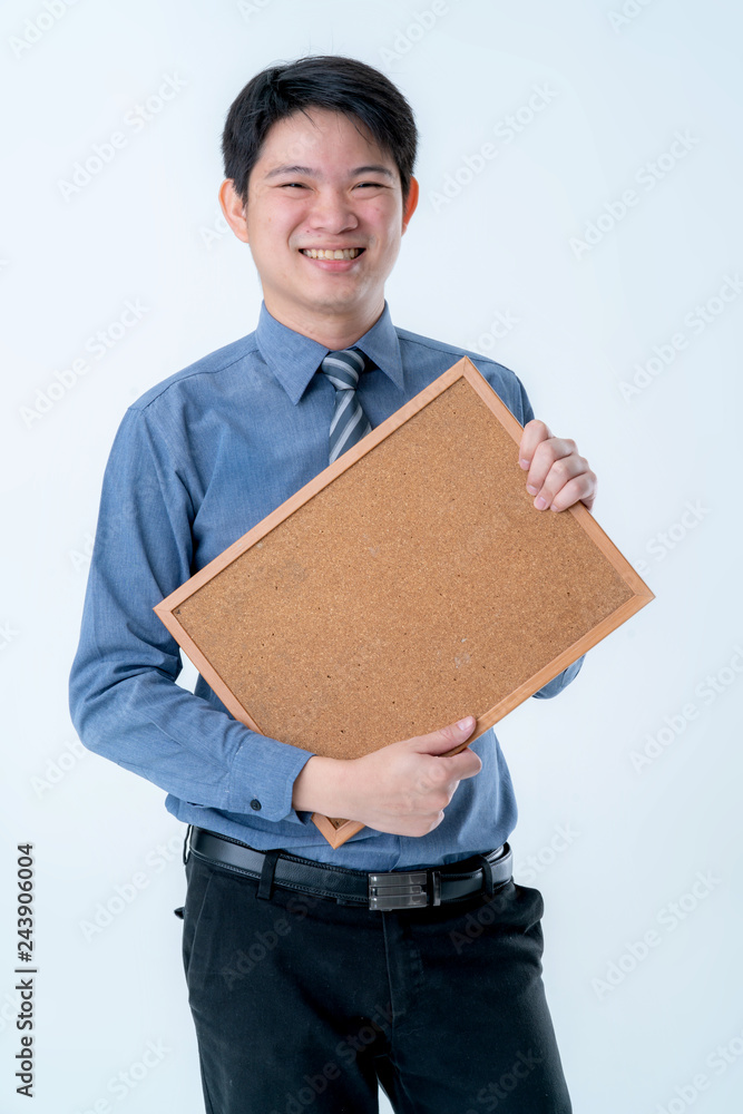 smile and happiness confident businessman hand hold cork board with free copy space white background